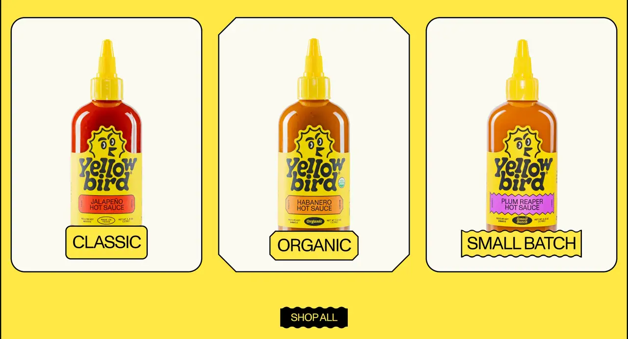 Секция «Товары» с сайта https://www.yellowbirdfoods.com/, тематика — Еда и напитки, цвета — Белый, Желтый, стиль — Карточный, Минимализм, типографика — Декоративные